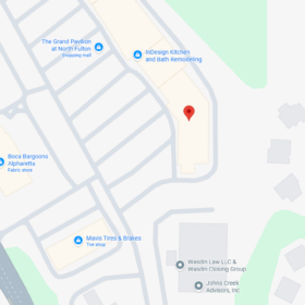 Map view with a red pin marking a building in a curved driveway within a shopping center